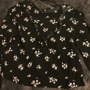 Black ruffled top with floral print